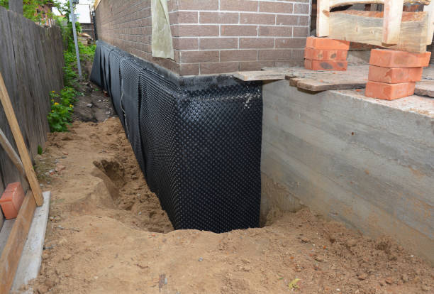 Happy homeowners after waterproofing job in Hohenwald